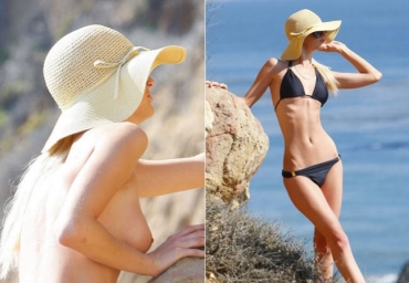 Paris Hilton faz topless na praia